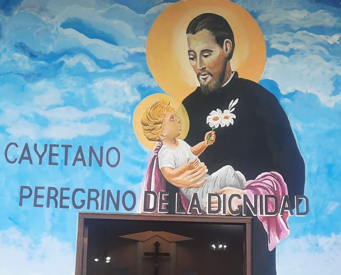 Pintura del mural de San Cayetano – Villa Esmeralda (Argentina, Salta)
